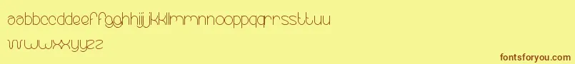 EssentialArrangement Font – Brown Fonts on Yellow Background