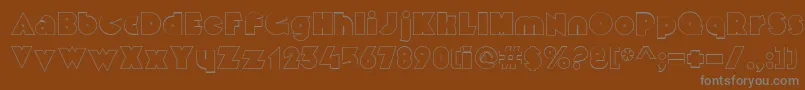 MekonOutlinealt-fontti – harmaat kirjasimet ruskealla taustalla