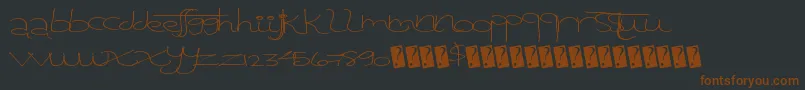 Tangentprint-fontti – ruskeat fontit mustalla taustalla
