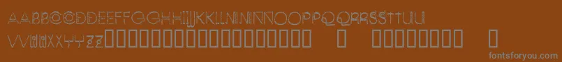 EnjoyTheAlien-Schriftart – Graue Schriften auf braunem Hintergrund