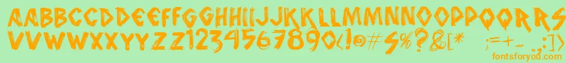 フォントVtks – オレンジの文字が緑の背景にあります。