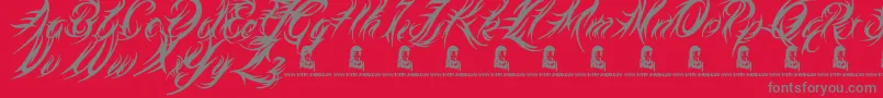 Fonte MedievalQueen – fontes cinzas em um fundo vermelho