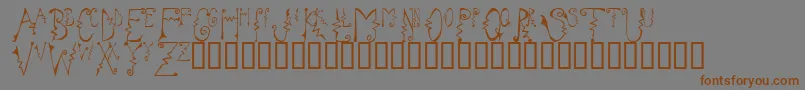 フォントCassz – 茶色の文字が灰色の背景にあります。