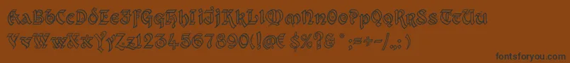 KingthingsXanderOutline Font – Black Fonts on Brown Background