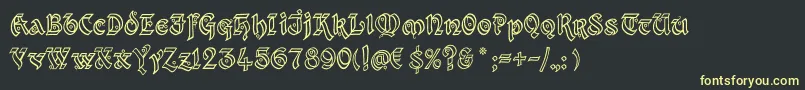 フォントKingthingsXanderOutline – 黒い背景に黄色の文字