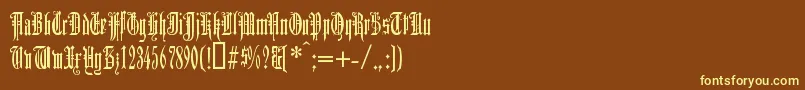 Duerergotisch-fontti – keltaiset fontit ruskealla taustalla