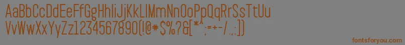 フォントPaktSemibold – 茶色の文字が灰色の背景にあります。