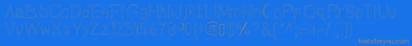 フォントTallnbubbly – 青い背景に灰色の文字