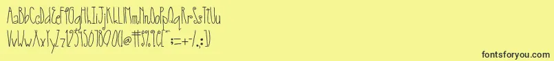 AustieBostSmallWorld Font – Black Fonts on Yellow Background