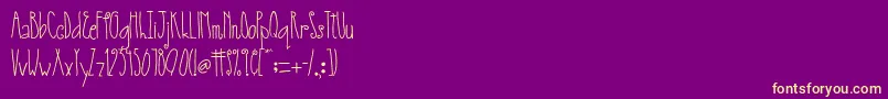 AustieBostSmallWorld Font – Yellow Fonts on Purple Background