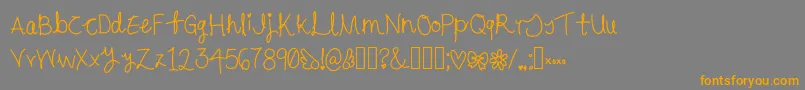 Czcionka Cursive – pomarańczowe czcionki na szarym tle