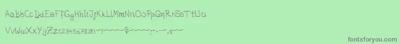 Fonte DrunkenHorrorGhost – fontes cinzas em um fundo verde