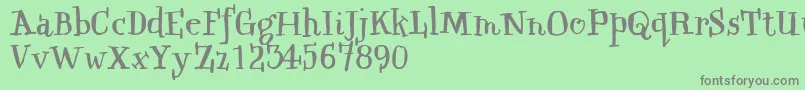 フォントQwinkwellFree – 緑の背景に灰色の文字