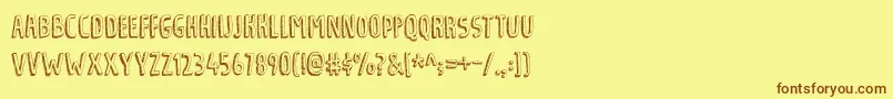 フォントTradizionalDemo – 茶色の文字が黄色の背景にあります。