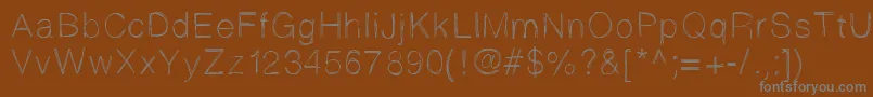 フォントSketchtica – 茶色の背景に灰色の文字