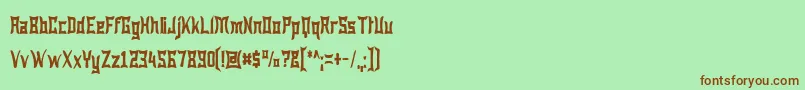 フォントWewakNarrow – 緑の背景に茶色のフォント