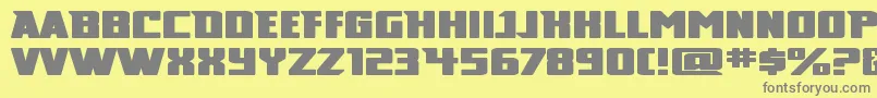 Broad-fontti – harmaat kirjasimet keltaisella taustalla