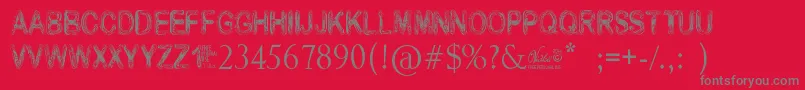 VidkaWoodcraft-fontti – harmaat kirjasimet punaisella taustalla