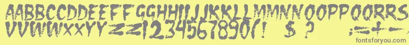 フォントDseraserc – 黄色の背景に灰色の文字