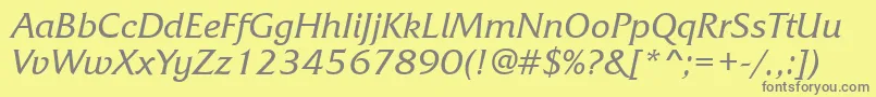 フォントFrizquadratabttItalic – 黄色の背景に灰色の文字