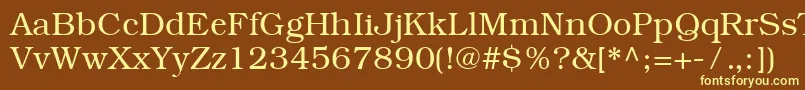 ItcBookmanCeLight-fontti – keltaiset fontit ruskealla taustalla