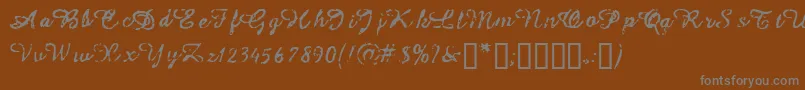 フォントIssac – 茶色の背景に灰色の文字