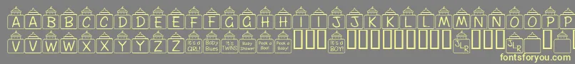 FlPeekababy-Schriftart – Gelbe Schriften auf grauem Hintergrund