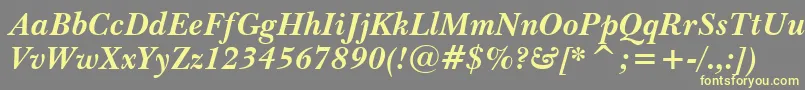 BaskervilleWin95btBoldItalic-fontti – keltaiset fontit harmaalla taustalla