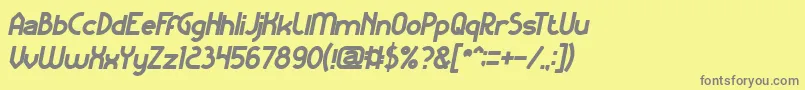 KangarooPunchItalicBold-fontti – harmaat kirjasimet keltaisella taustalla