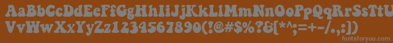 Keepontruckin Font – Gray Fonts on Brown Background