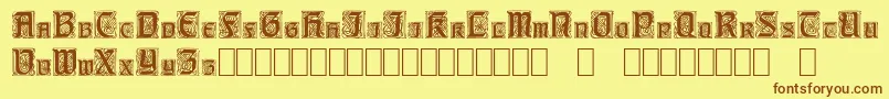 フォントCarrickCapitals – 茶色の文字が黄色の背景にあります。