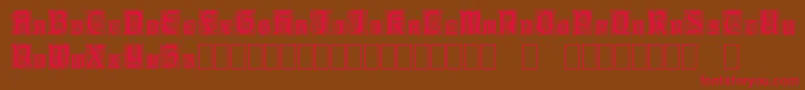 CarrickCapitals-fontti – punaiset fontit ruskealla taustalla