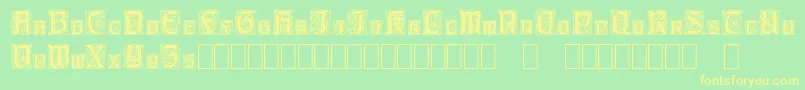 フォントCarrickCapitals – 黄色の文字が緑の背景にあります