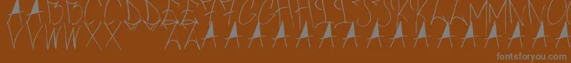 フォントBrushOfAnarchy – 茶色の背景に灰色の文字