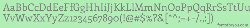 フォントEnriquetaRegular – 緑の背景に灰色の文字