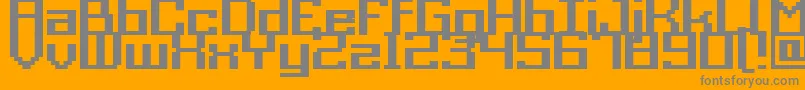 Fonte GrixelAcme9RegularBold – fontes cinzas em um fundo laranja
