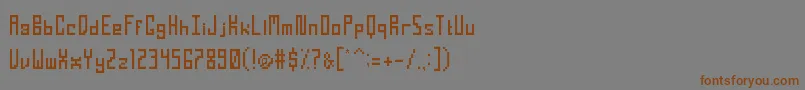 フォントTightPixel – 茶色の文字が灰色の背景にあります。