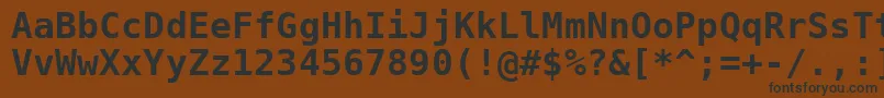 フォントDejavusansmono ffy – 黒い文字が茶色の背景にあります