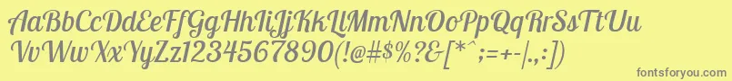 LobstertwoItalic-fontti – harmaat kirjasimet keltaisella taustalla