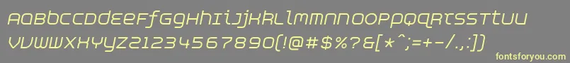 AspirinAdvanceitalic-fontti – keltaiset fontit harmaalla taustalla