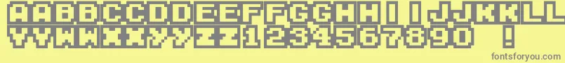 M04-fontti – harmaat kirjasimet keltaisella taustalla