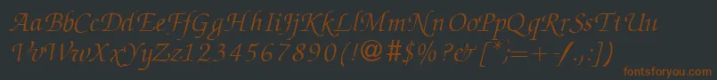 Czcionka ZabriskiescriptRegularitalicDb – brązowe czcionki na czarnym tle