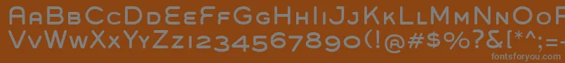 GroverCaps Font – Gray Fonts on Brown Background