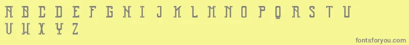 フォントReliquary – 黄色の背景に灰色の文字