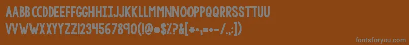 Kgtangledupinyou2 Font – Gray Fonts on Brown Background