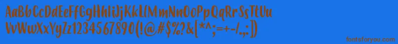 フォントBudidayaRegular – 茶色の文字が青い背景にあります。