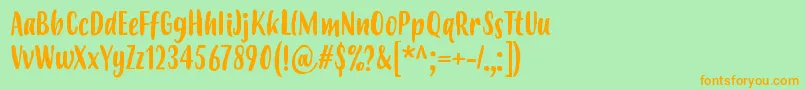 フォントBudidayaRegular – オレンジの文字が緑の背景にあります。