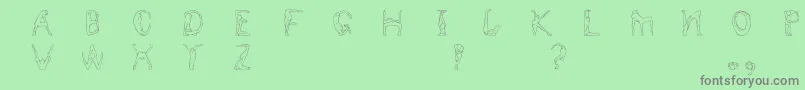 Humancap Font – Gray Fonts on Green Background