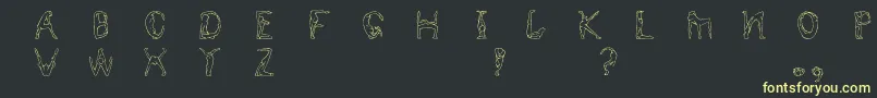 Humancap Font – Yellow Fonts on Black Background