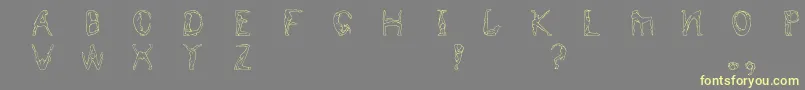 Humancap Font – Yellow Fonts on Gray Background